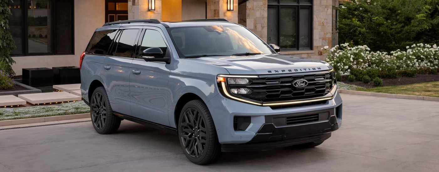 Blue 2026 Ford Expedition parked in a driveway.