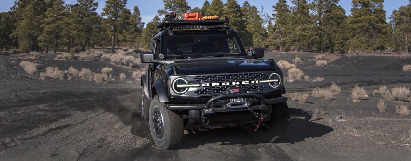 A black 2024 Ford Bronco parked off-road