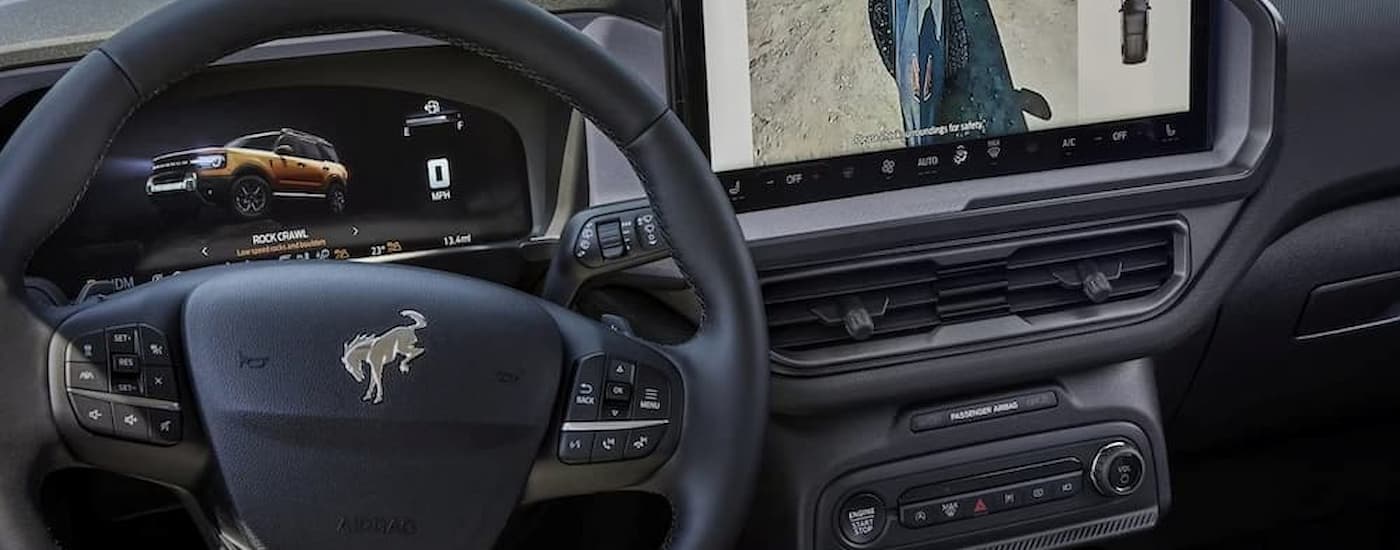 Infotainment display and steering wheel in a 2025 Ford Bronco for sale
